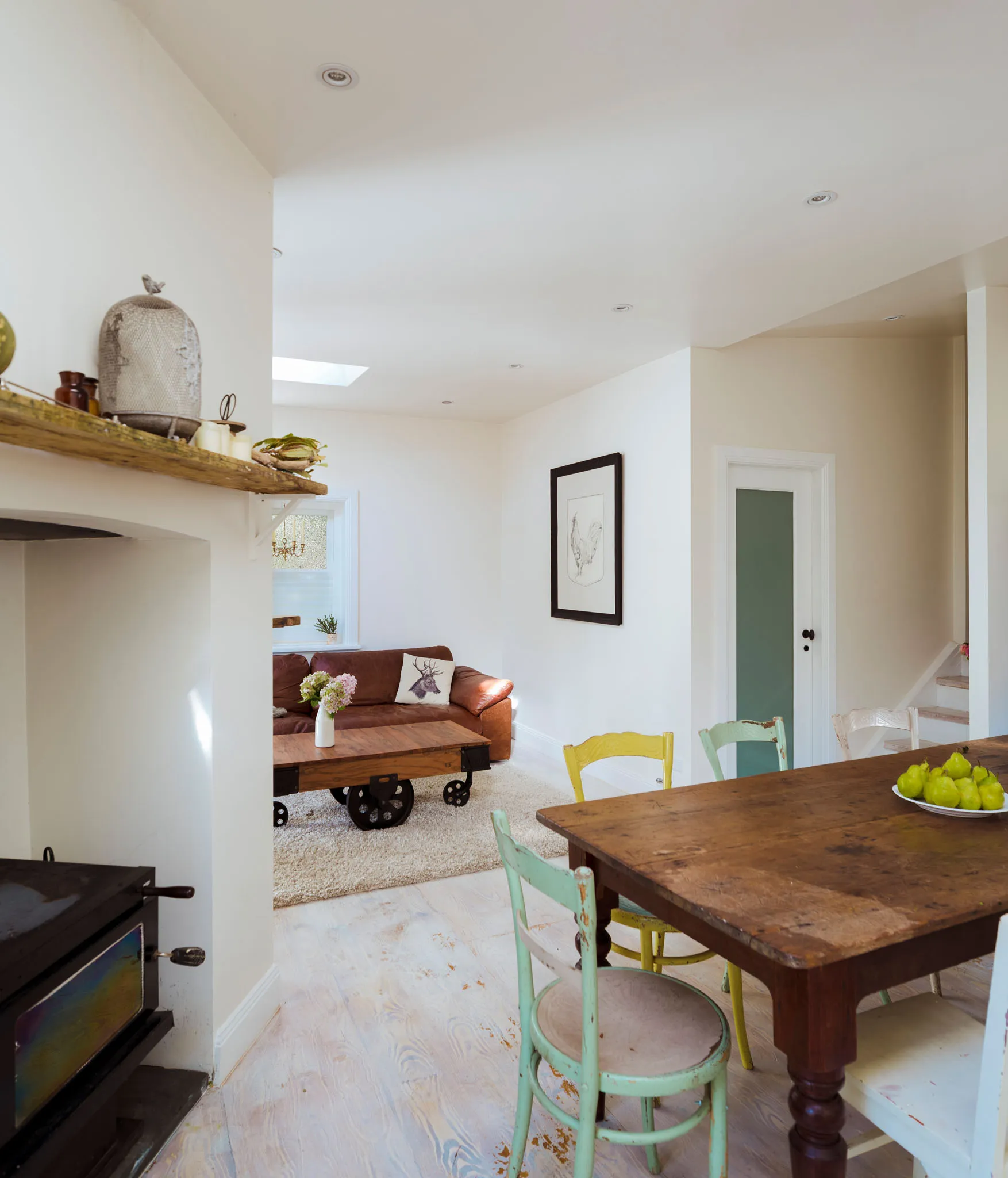 Fire built ready to light — two logs, firelighters and matches in bucket