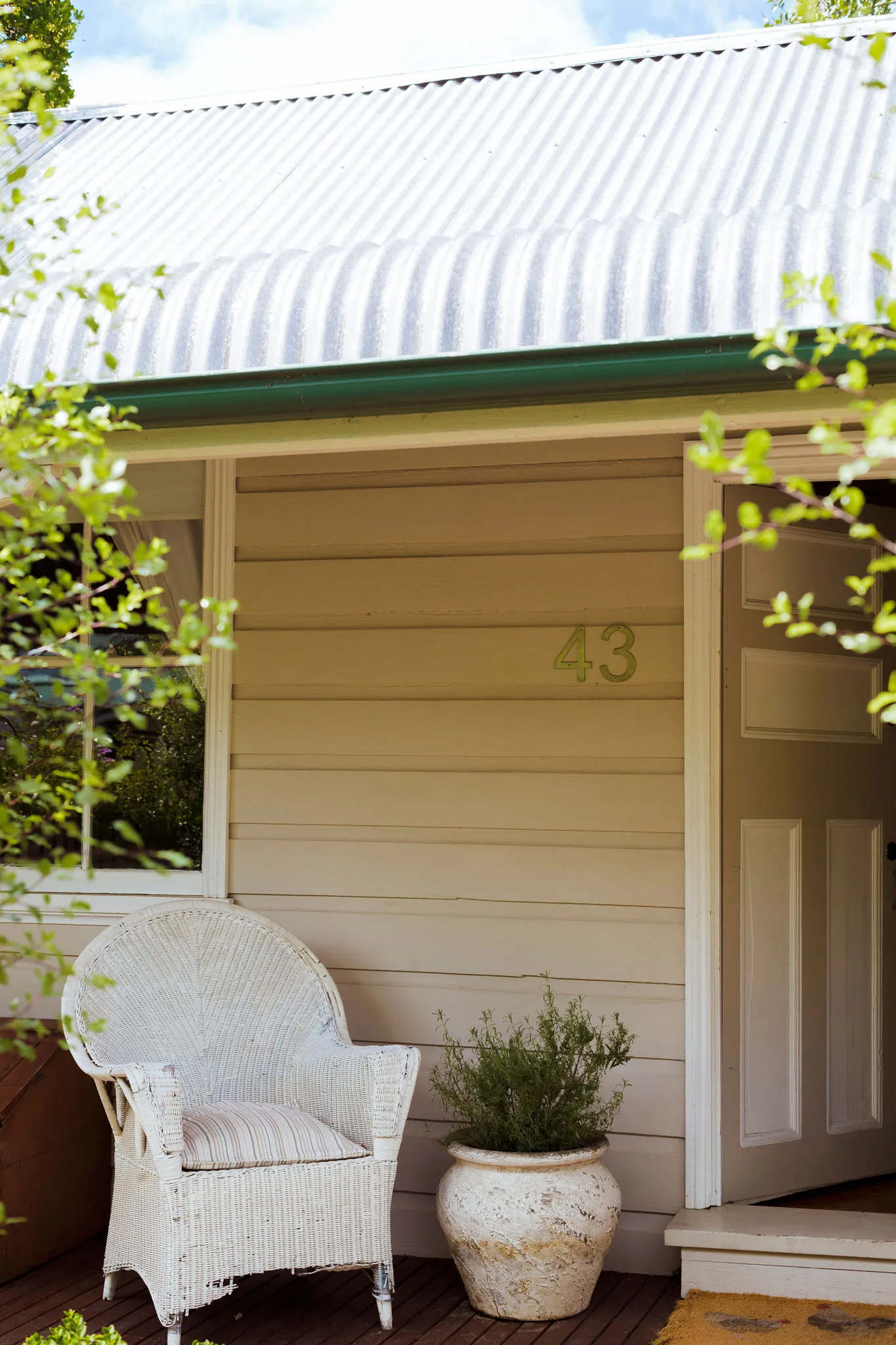 Wicker chair on the verandah beside the front door